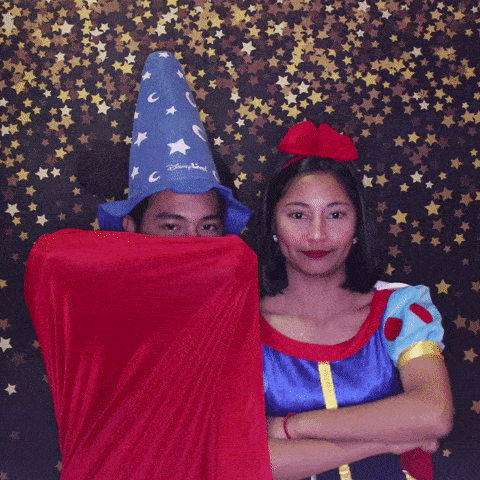 Couple dressed in costumes at GIF photo booth