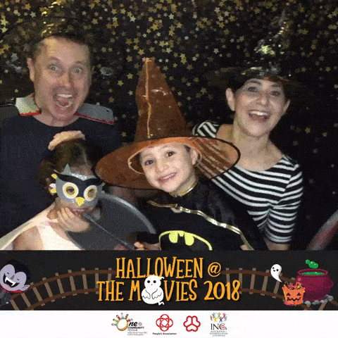 Family wearing Halloween hats at GIF photo booth