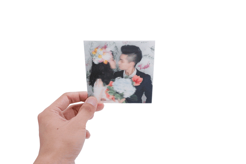 Holographic print of wedding couple kissing at photo booth