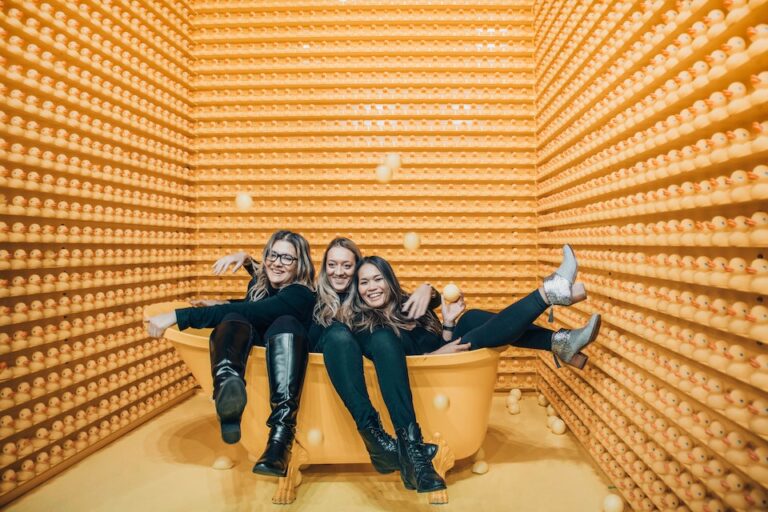 Photo booth installation with 3 women posing for photo