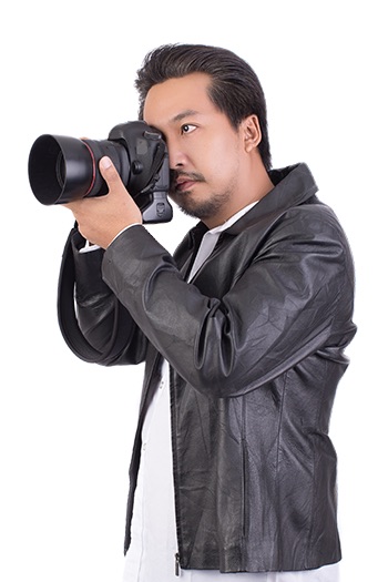 Professional event photographer holding DSLR