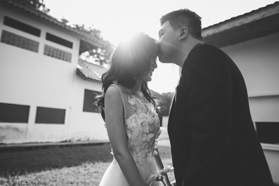 Couple kissing on their pre-wedding photoshoot event photography wedding outdoor venue