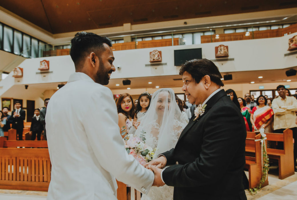 Bride meeting Groom at the front of the stage wedding photography ceremony photograph