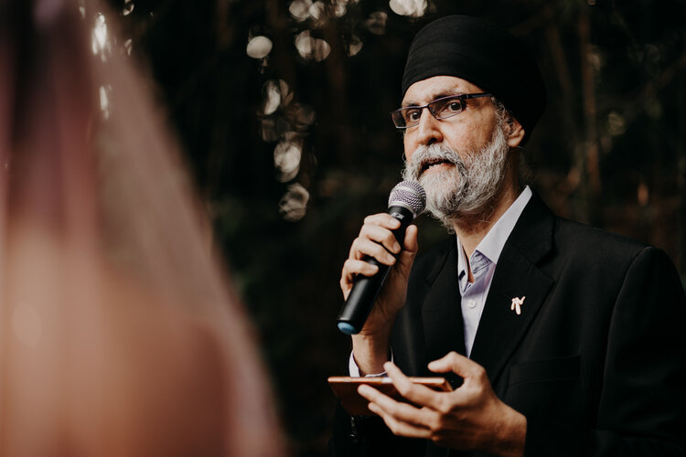 Wedding Officiant addressing the couple at a wedding photograph photography event 