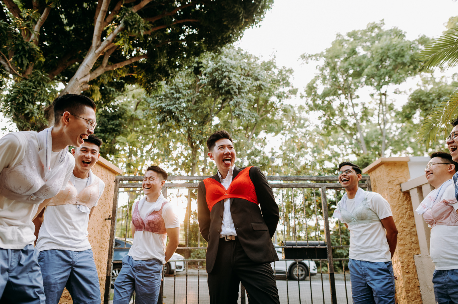 Groomsmen participating in games having memorable time photography photographer wedding event