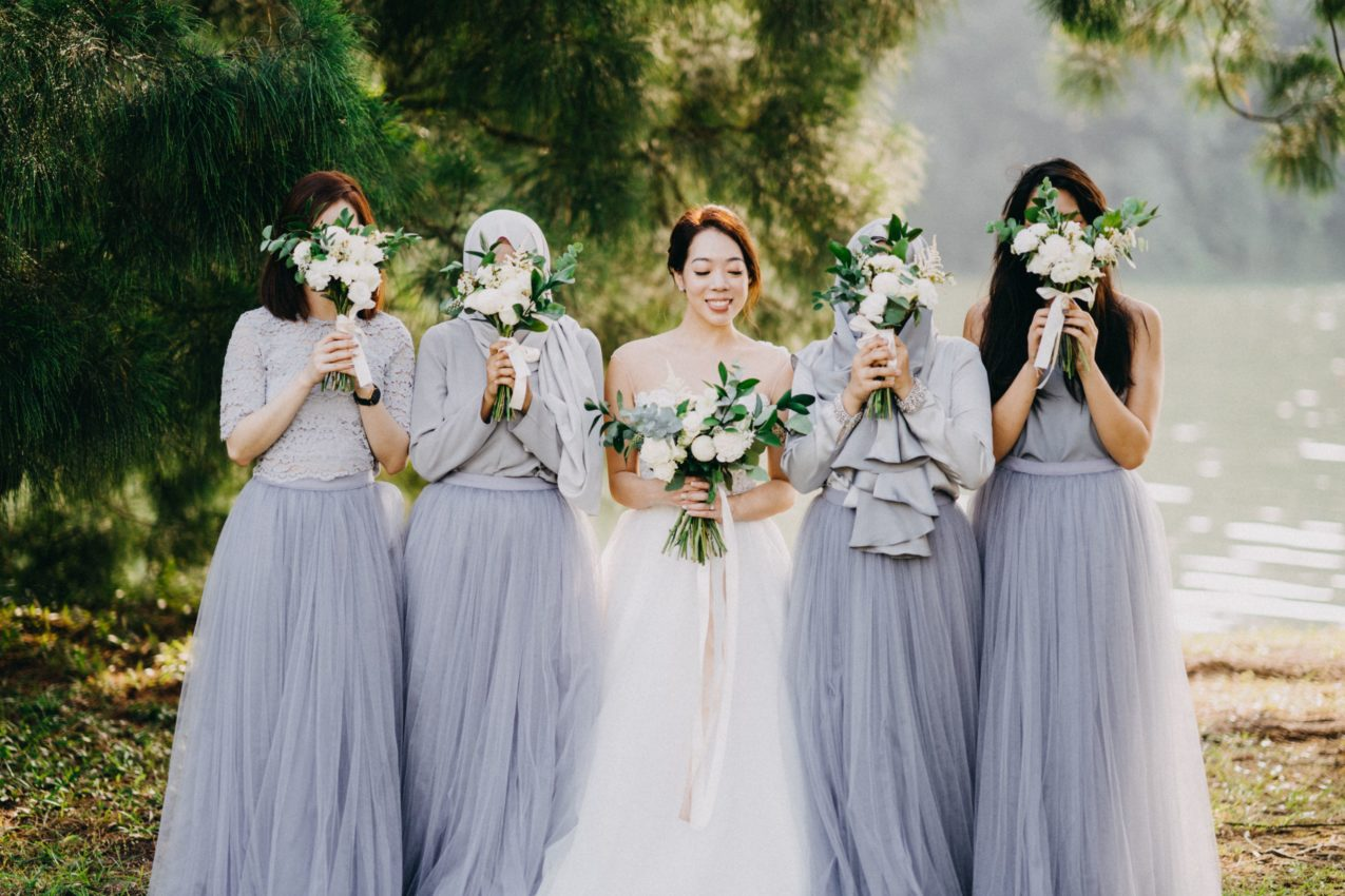 Bride and Bridesmaids having photoshoot at outdoor venue for wedding ceremony photoshoot photography