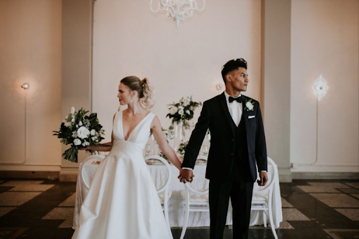 Wedding Couple looking away from each other at their wedding venue for wedding ceremony photographer photography