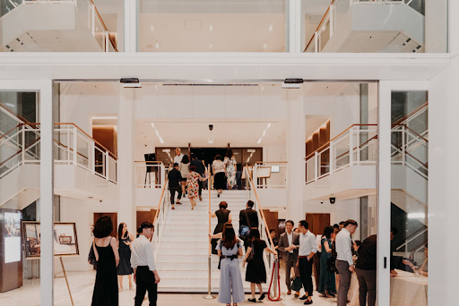 Wedding venue at the entrance with guests walking around the venue wedding photography photograph