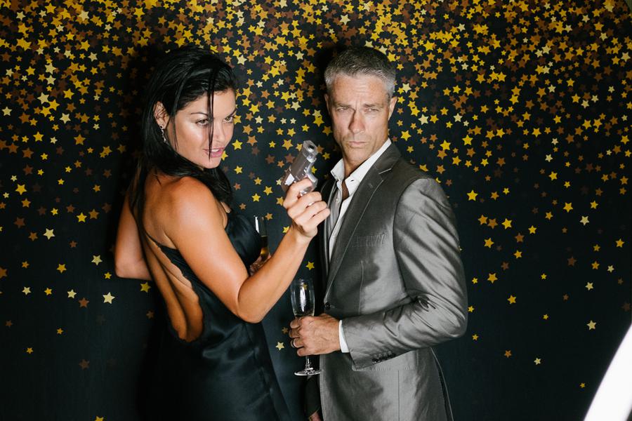 Guests strike a pose against a star-studded backdrop.